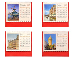 Tabletop calendar showing Sep–Dec 2027 month grids on red backing
