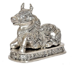 Brass Nandi cow statue idol, close side view, textured face and decorative base