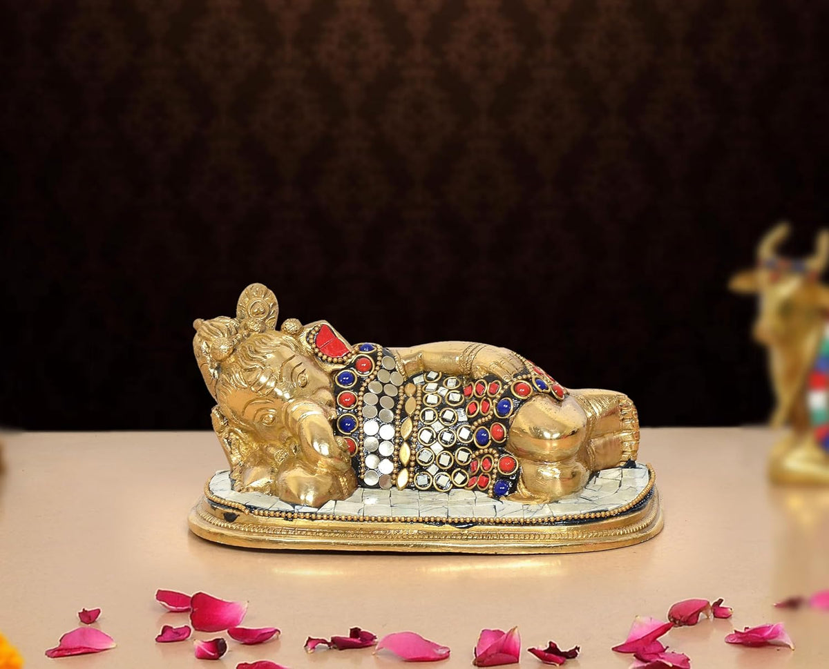 Brass Ganesha relaxing statue with multicolor jeweled details on a raised base