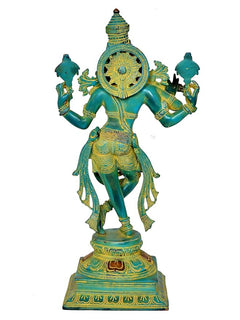 Rear view Krishna playing flute statue, turquoise-green figure with gold halo and arms