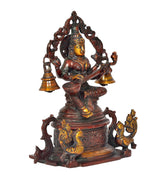 Side view Saraswati deity sitting on swan, holding veena with curved bell holders
