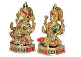Brass Lakshmi Ganesh statue, angled view showing raised hands and decorated crowns