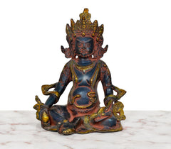 Seated Kuber brass figurine with blue-black body and gold-trim jewelry, front view
