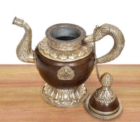 Brass teapot with open top, ornate lid rim, side spout, and rope handle chain