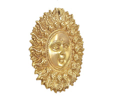 Brass Surya dev wall hanging, right-side angle showing profile face and engraved halo