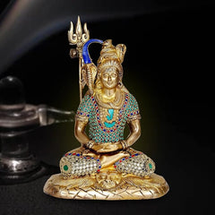 Gold-toned brass Shiva statue meditating in lotus, trident, blue arch, jeweled details