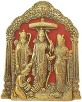 Golden Ram Darbar relief with standing deities beneath an ornate canopy
