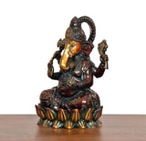 Lord Ganesha brass idol in profile, seated with four arms and decorated lotus pedestal
