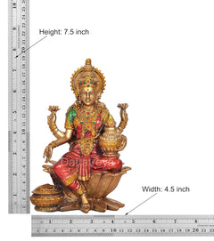 Resin Lakshmi statue, height 7.5 in, width 4.5 in, green-red outfit, seated on lotus