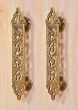 Brass filigree door pull handles with round backplate and floral scrollwork, pair