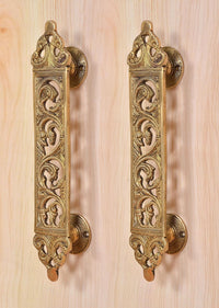Brass filigree door pull handles with round backplate and floral scrollwork, pair