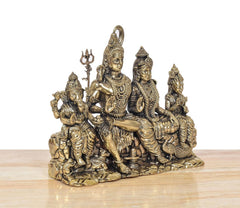 Close side view of 7-inch brass Shiv Parivar family idol with trident-bearing deity