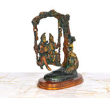 Brass Shiva Swings murti with Parvati and Ganesha, angled view on pedestal