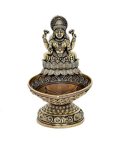 Brass Lakshmi diya oil lamp figurine, detailed seated goddess in circular base