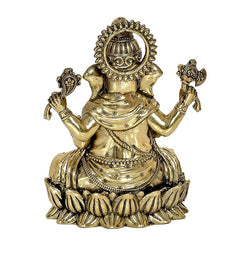 Brass Ganesha statue, three-quarter view, detailed crown and lotus base