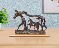 Resin horse and foal figurine, dark brown with golden mane on base.