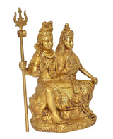 Brass Shiva and Parvati statue seated, holding trident pole