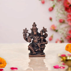 Copper Lakshmi Varaha idol, seated deity with attendants, dark bronze finish