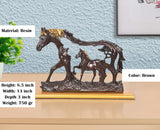 Resin horse and foal showpiece, brown horses with golden manes on display base.