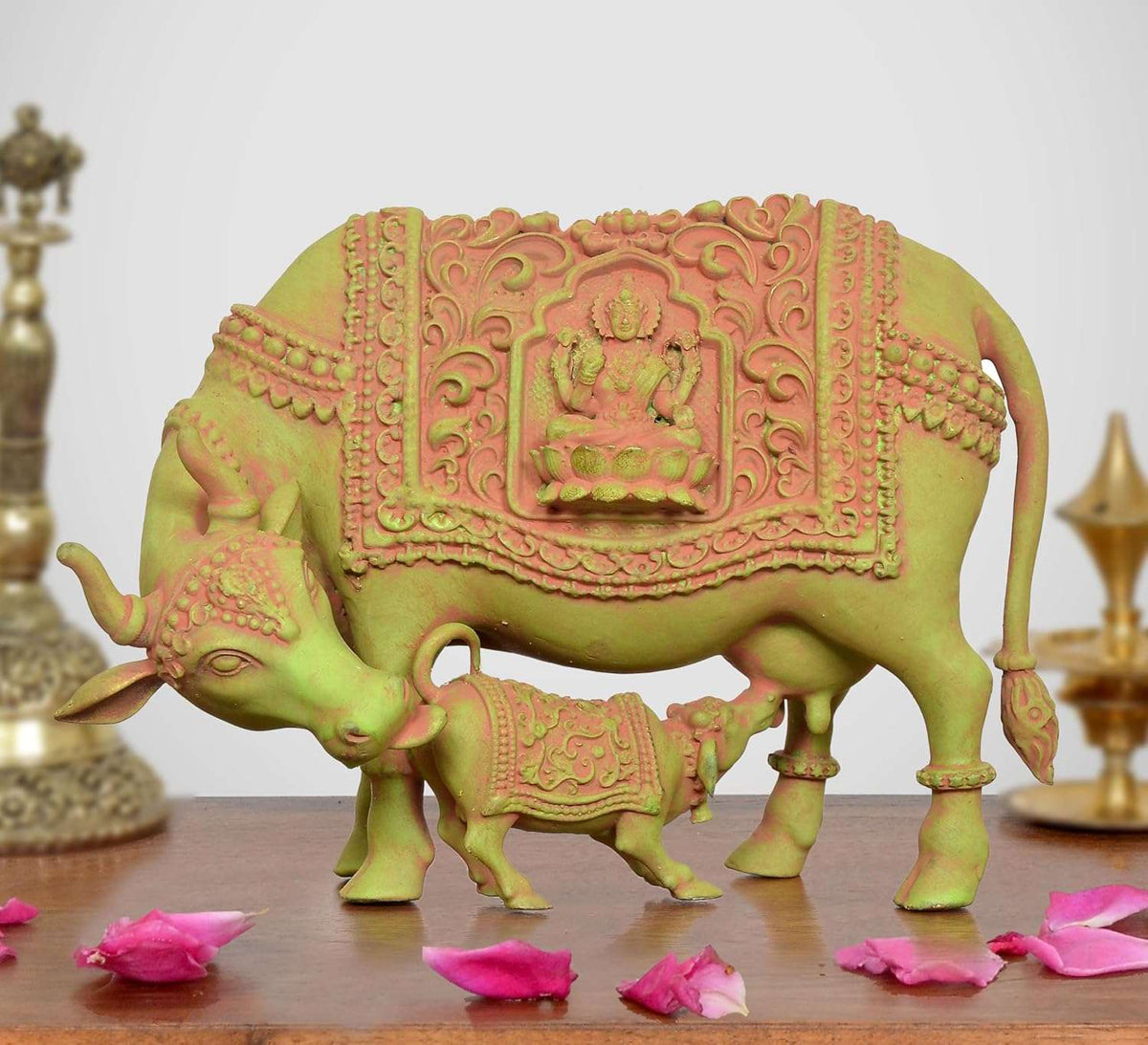 Brass Kamdhenu cow statue with calf and Lakshmi panel, decorative raised relief