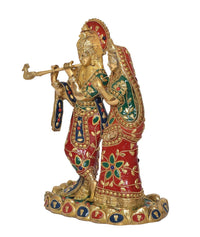 Brass Radha Krishna statue idol in side view, red and green jeweled garments