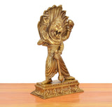 Brass Lord Narasimha idol, golden face and torso details, standing pose on ornate base