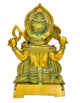 Back view of brass Ganesha statue, multi-color finish, halo-like arch and draped cloth
