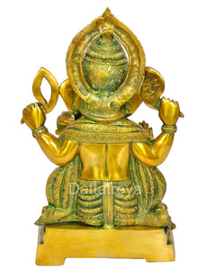 Back view of brass Ganesha statue, multi-color finish, halo-like arch and draped cloth