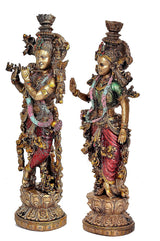 Radha Krishna resin statue pair, 3/4 side angles showing decorated robes and elaborate headdresses