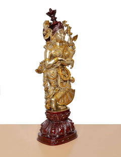 Brass Radha Rani murti, detailed torso and layered skirt, dark red foot pedestal