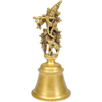 Brass Krishna bell idol, 7-inch tall, ornate deity standing on bell base