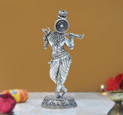 Lord Krishna brass idol, rear view with ornate medallion on head