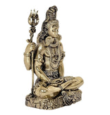 Angle view brass Lord Shiva sculpture with trident, layered jewelry details, 3 inch