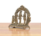 Brass ram darbar statue, side view, carved arch frame with three standing deities