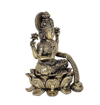 Brass Lakshmi idol statue on lotus base, detailed jewelry and beaded garland
