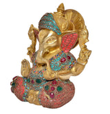 Ganesha brass statue side view, turquoise crown, red wings, multicolor gems