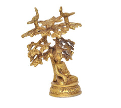 Golden brass Buddha tree idol, angled view of seated Buddha on round base