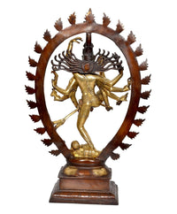 Brass Natraj dancing showpiece from side angle, one leg up; rounded spiked halo