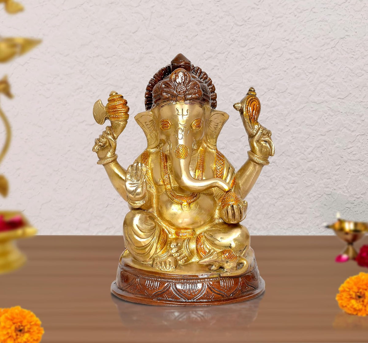 Brass Lord Ganesha idol statue with four arms and seated pose, gold finish