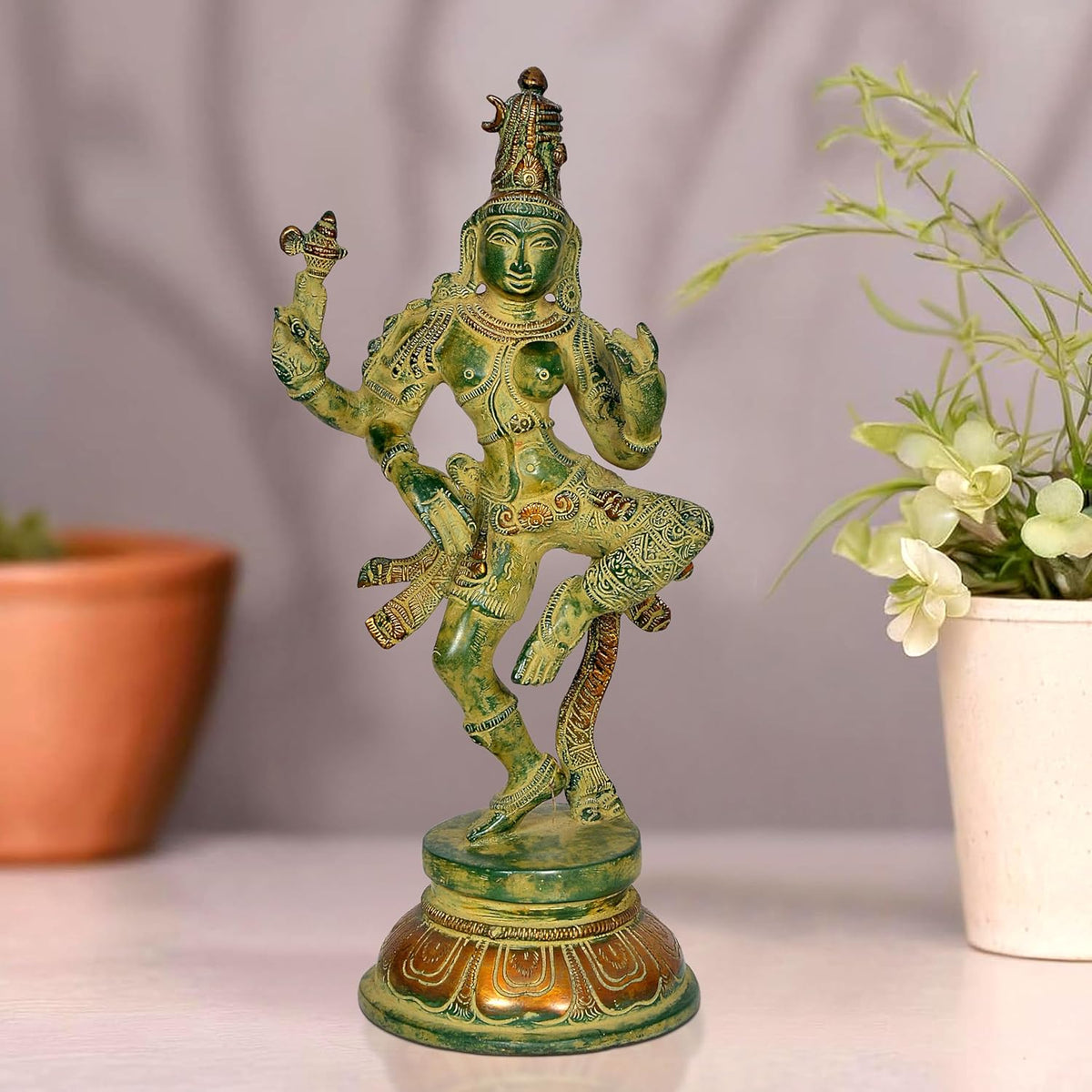 Brass Ardhanrishvara dancing Shiva-Parvati statue, green-gold patina, standing on base