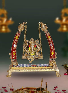 Brass Ganesha swing showpiece with red-gold decorated arms and chains, seated on platform