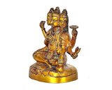 Brass Dattatreya sitting statue with four-faced head and ornate jewelry, 4.5 in