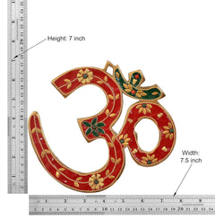 Brass OM wall hanging sculpture; 7 in height, 7.5 in width, red/green enamel gold trim