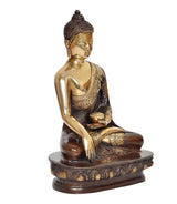 Brass Buddha statue angled view, seated meditation pose with dhyan mudra on dark base