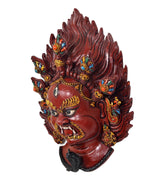 Resin Mahakal wall mask profile view, red face with jeweled accents and flame crown