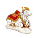 Nandi polyresin statue, red cape-like saddle with gold trim, 7.5 in