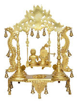 Golden brass Radha Krishna swing idol statue with sculpted figures and bell accents