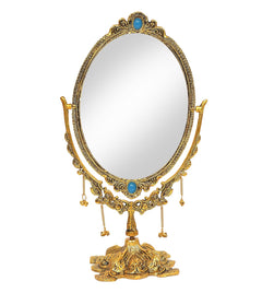 Standing oval tabletop mirror, gold ornate frame with blue jewel top and bottom, bead chains