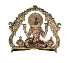 Rear view of Lakshmi idol with arched frame, seated figure, and engraved details