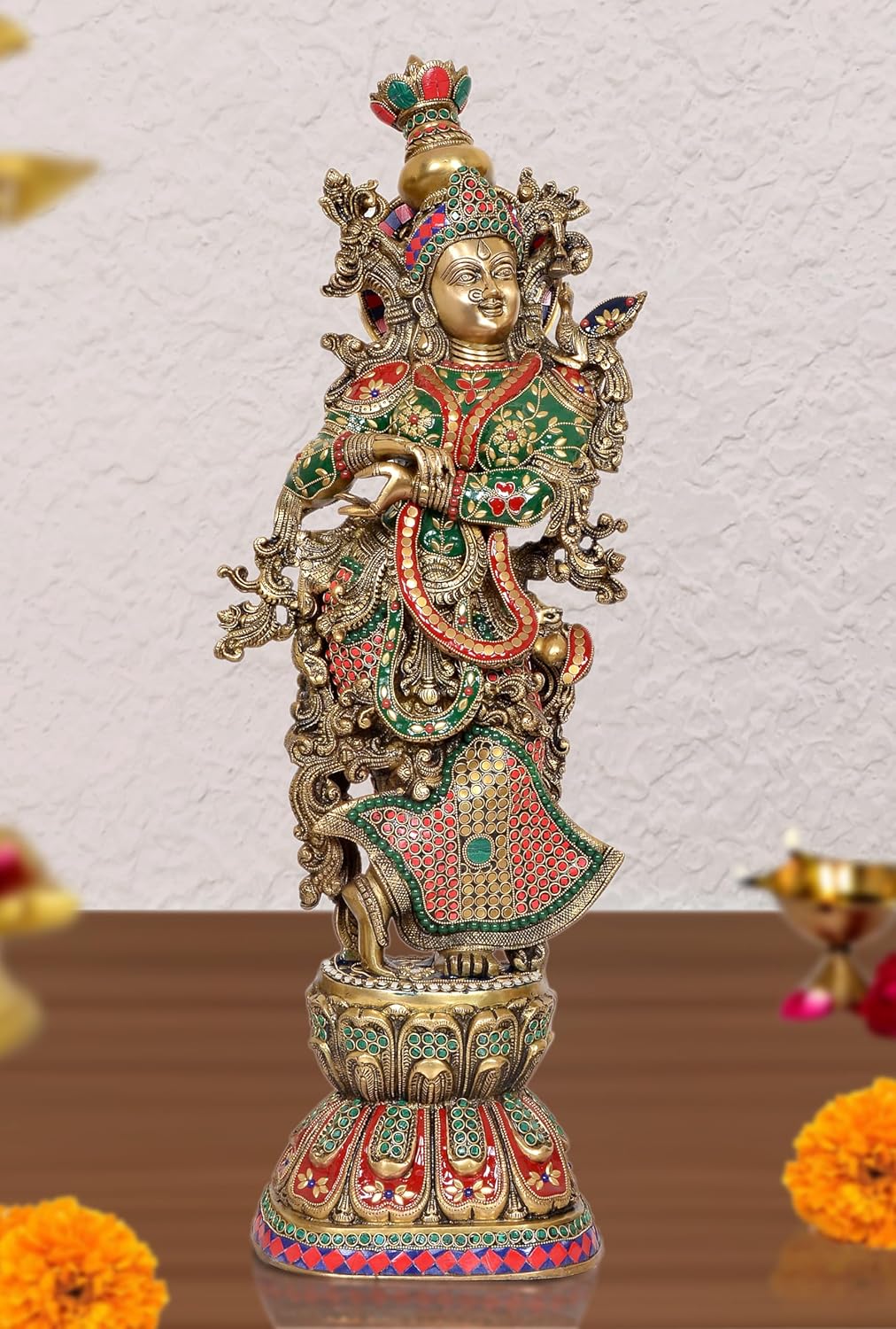 Brass Radha idol statue with green-red attire, gold crown, and ornate halo